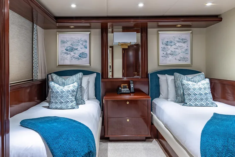 Starship Yacht Photos Pics Luxurious 1988 Van Mill Custom yacht cabin with twin beds, elegant decor, and plush pillows.