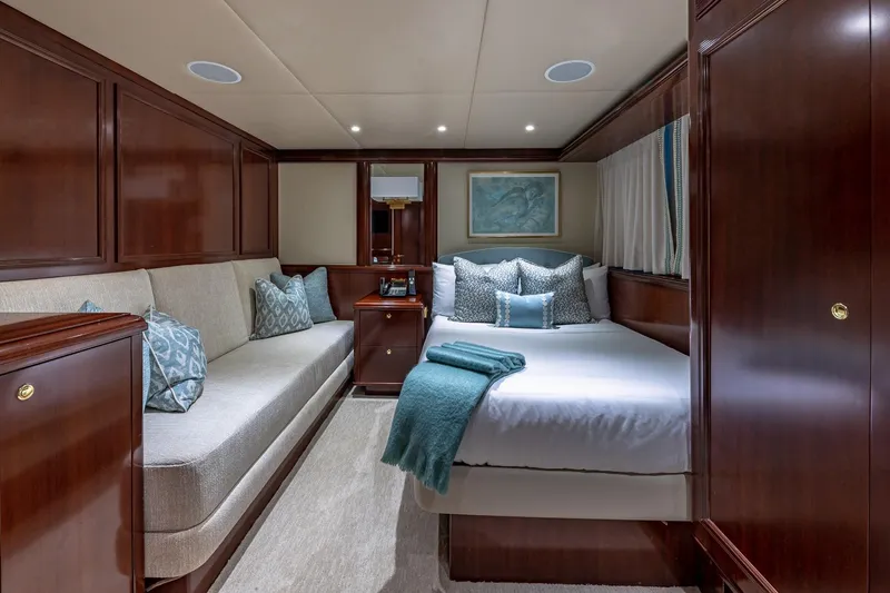Starship Yacht Photos Pics Luxurious 1988 Van Mill Custom yacht cabin with elegant wood paneling and plush bedding.
