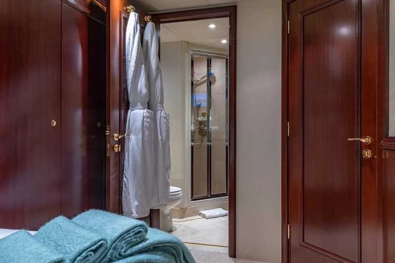 Starship Yacht Photos Pics Luxurious 1988 Van Mill Custom yacht interior with elegant wood finishes and modern bathroom.