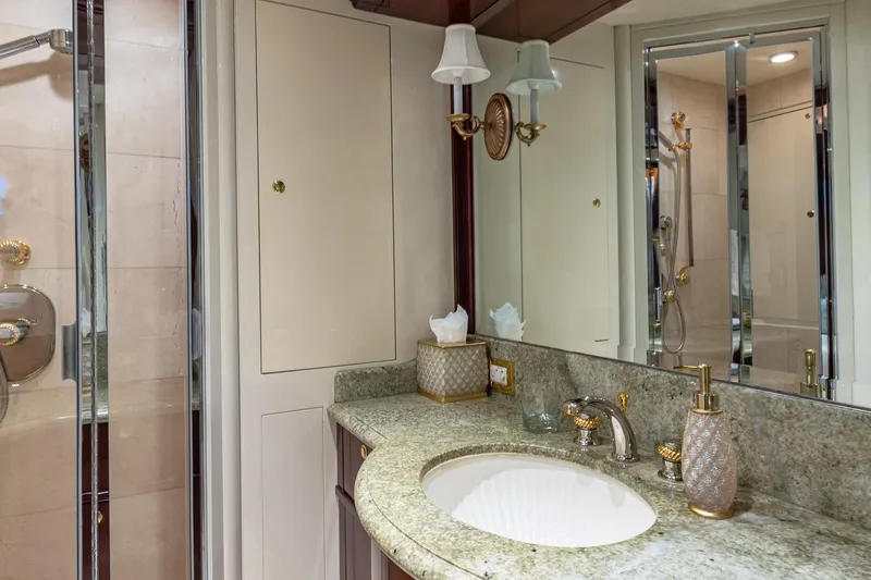 Starship Yacht Photos Pics Luxurious 1988 Van Mill Custom bathroom with granite countertop and elegant fixtures.