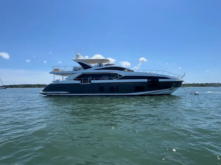 Mastermind Yacht Photos Pics 2019 Azimut Grande 27M yacht on calm water under clear blue sky.