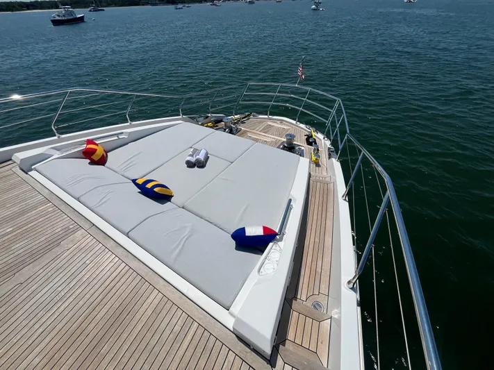 Mastermind Yacht Photos Pics Luxurious 2019 Azimut Grande 27M yacht deck with sunbathing area and colorful cushions.