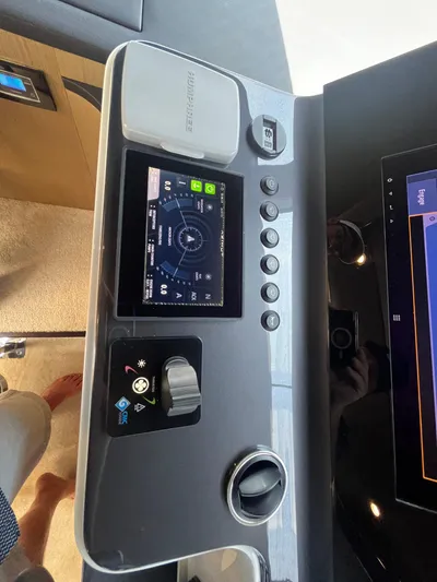 Mastermind Yacht Photos Pics Control panel of 2019 Azimut Grande 27M yacht with navigation display and controls.