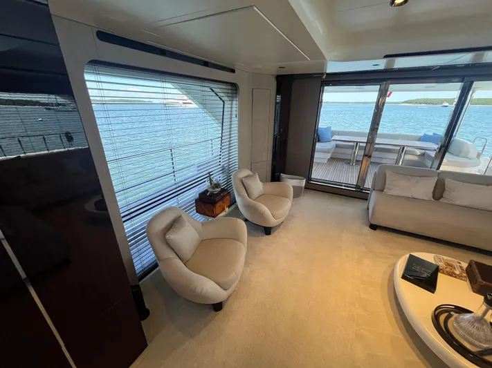 Mastermind Yacht Photos Pics Luxurious interior of 2019 Azimut Grande 27M yacht with elegant seating and ocean view.