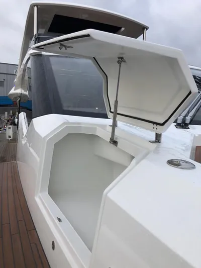  Yacht Photos Pics 2020 Galeon 680 Fly yacht with open storage compartment on deck.