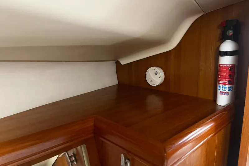 Honu Yacht Photos Pics Interior of 2006 Hunter 41 Deck Salon with fire extinguisher and smoke detector.