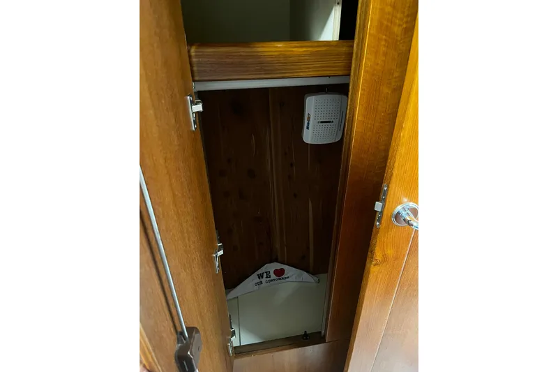 Honu Yacht Photos Pics Wooden cabinet interior on 2006 Hunter 41 Deck Salon yacht, featuring a dehumidifier.