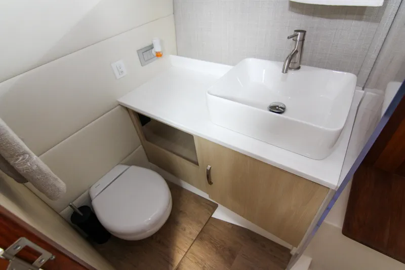  Yacht Photos Pics Modern bathroom in 2023 Regal 38 SAV boat with sink and toilet.