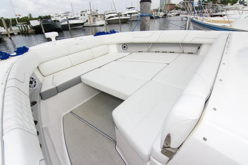 Yacht Photos Pics Luxurious seating area on 2023 Regal 38 SAV yacht at marina.