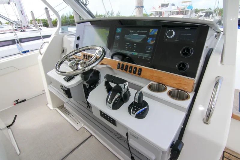  Yacht Photos Pics 2023 Regal 38 SAV helm with modern controls and navigation display.