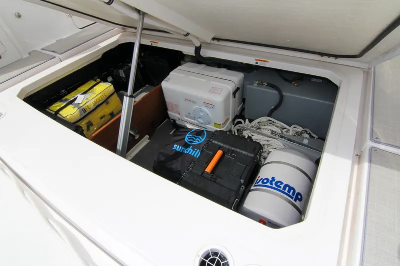  Yacht Photos Pics Storage compartment of 2023 Regal 38 SAV boat with equipment and life jackets.