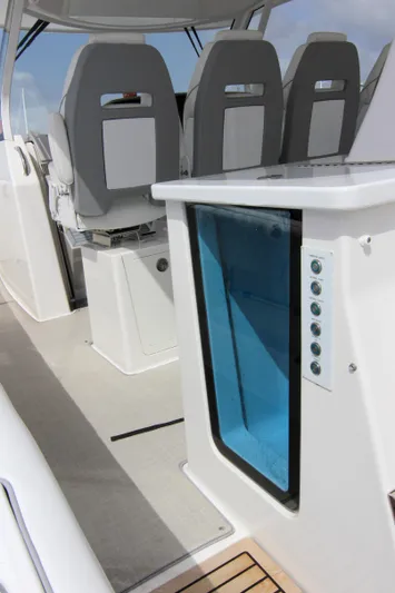  Yacht Photos Pics 2023 Regal 38 SAV interior with modern seating and sleek design features.