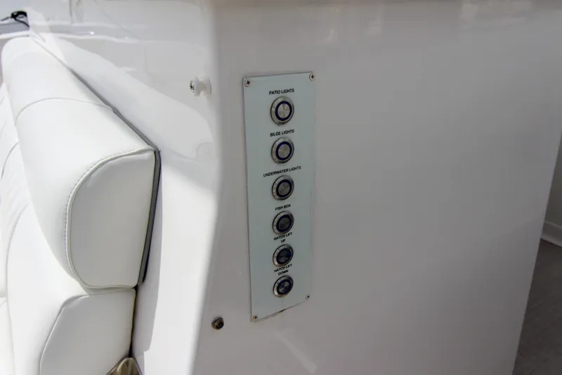  Yacht Photos Pics Control panel on 2023 Regal 38 SAV boat with labeled buttons for various functions.