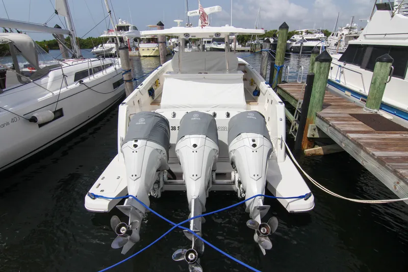 Yacht Photos Pics 2023 Regal 38 SAV boat docked with triple Yamaha outboard engines.