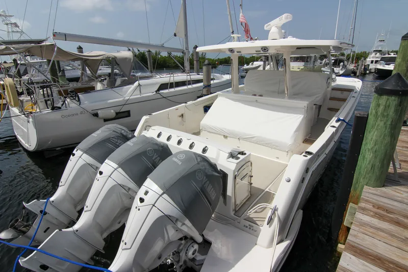 Yacht Photos Pics 2023 Regal 38 SAV boat docked with triple Yamaha outboard engines.