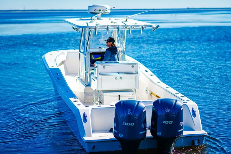  Yacht Photos Pics 2015 Invincible 33 Open Fisherman boat on open water with dual engines.