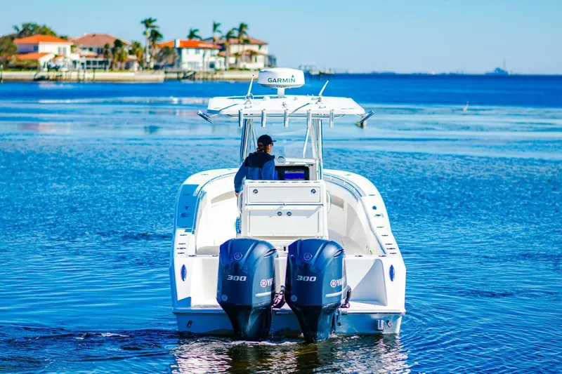  Yacht Photos Pics 2015 Invincible 33 Open Fisherman boat cruising on a sunny day.