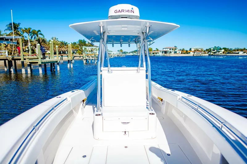  Yacht Photos Pics 2015 Invincible 33 Open Fisherman boat on calm water, featuring Garmin equipment.