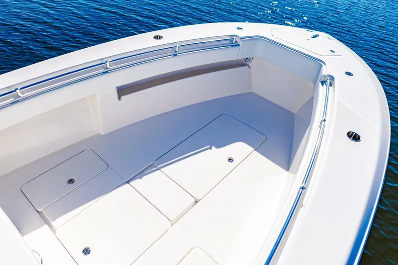  Yacht Photos Pics 2015 Invincible 33 Open Fisherman boat deck on calm water.