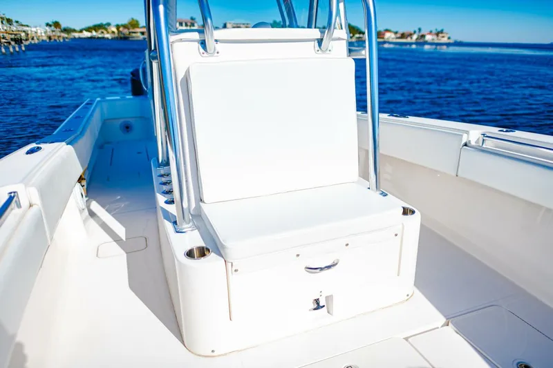  Yacht Photos Pics 2015 Invincible 33 Open Fisherman boat interior with seating, on a sunny day.