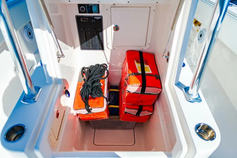  Yacht Photos Pics Storage compartment of 2015 Invincible 33 Open Fisherman with safety gear and ropes.
