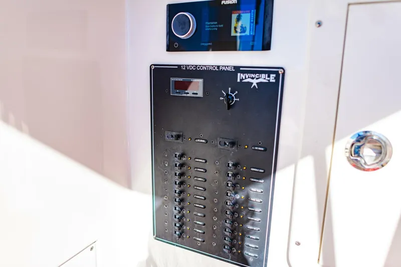  Yacht Photos Pics 2015 Invincible 33 Open Fisherman control panel with Fusion audio system.