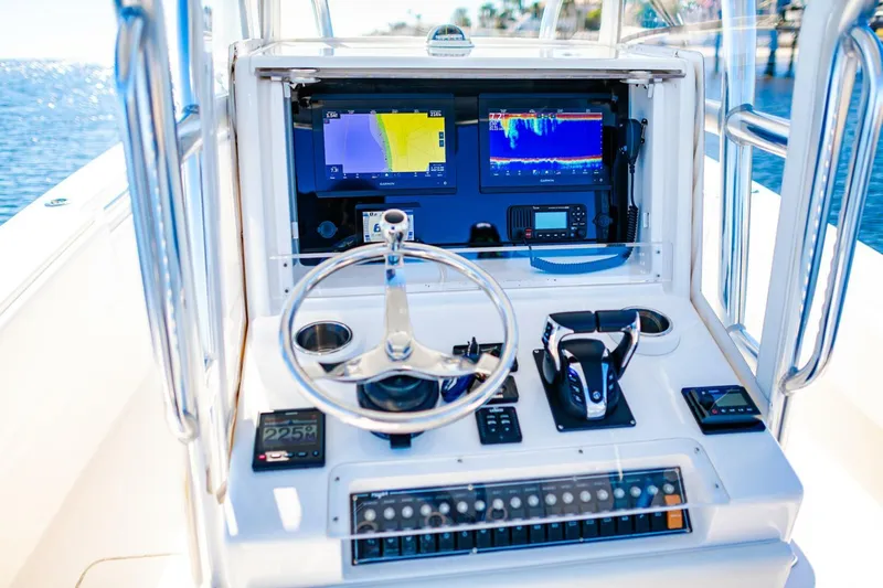  Yacht Photos Pics Invincible 33 Open Fisherman 2015 helm with advanced navigation and control systems.