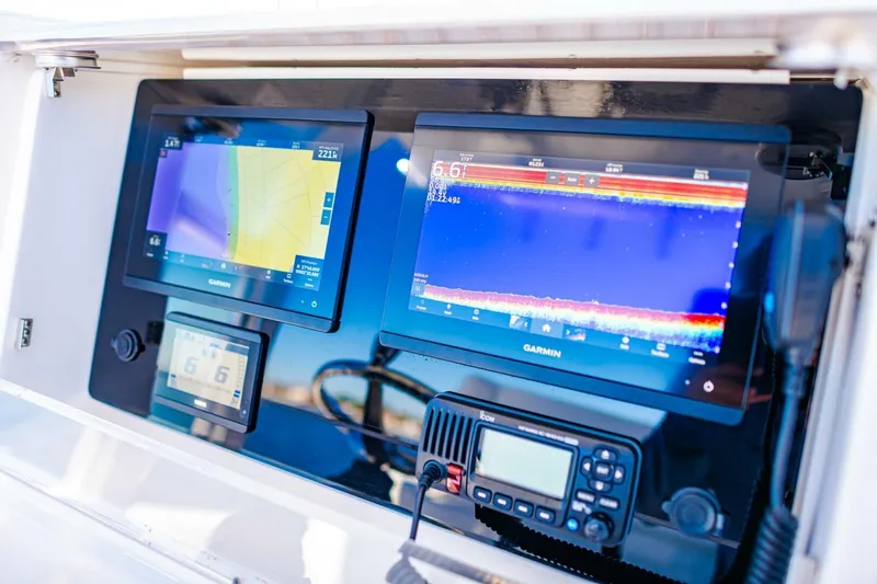  Yacht Photos Pics 2015 Invincible 33 Open Fisherman dashboard with Garmin navigation displays.