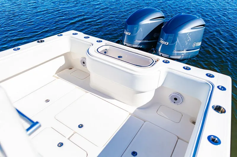  Yacht Photos Pics 2015 Invincible 33 Open Fisherman boat with twin Yamaha engines on calm water.