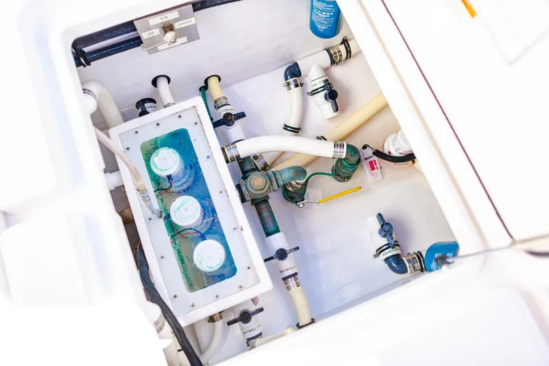  Yacht Photos Pics 2015 Invincible 33 Open Fisherman boat plumbing system with pipes and valves.