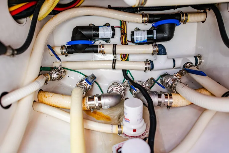  Yacht Photos Pics Boat plumbing system of 2015 Invincible 33 Open Fisherman with hoses and fittings.