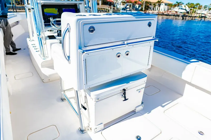  Yacht Photos Pics 2015 Invincible 33 Open Fisherman boat interior with storage and seating.