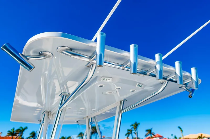  Yacht Photos Pics 2015 Invincible 33 Open Fisherman boat with rod holders against a clear blue sky.