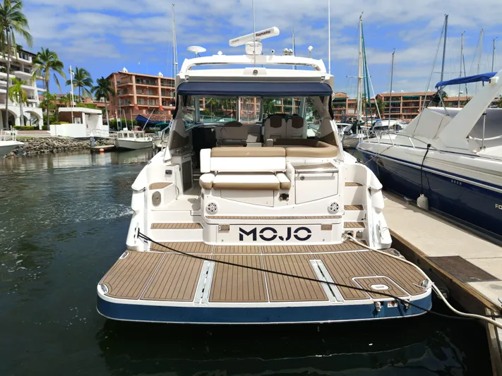 2016 Four Winns H440 Yacht Photos Pics 2016 Four Winns H440 yacht docked in a marina, rear view with "MOJO" on the stern.