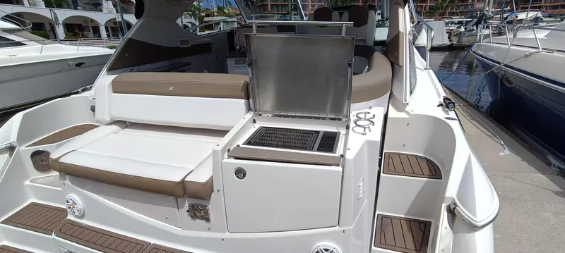 2016 Four Winns H440 Yacht Photos Pics 2016 Four Winns H440 boat with outdoor seating and grill on deck.