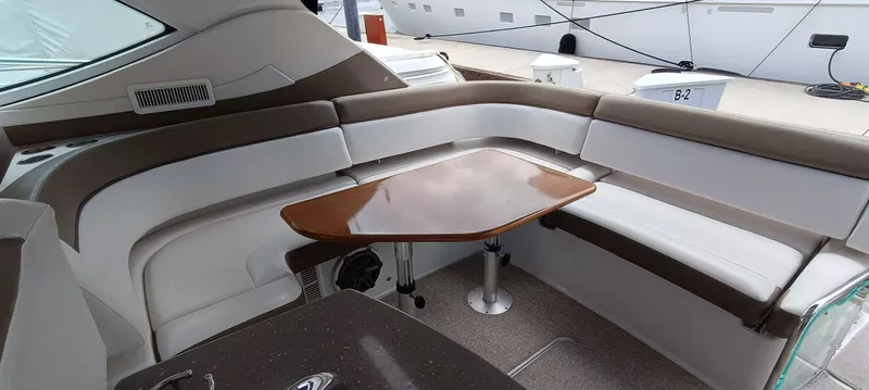 2016 Four Winns H440 Yacht Photos Pics 2016 Four Winns H440 yacht interior with elegant seating and wooden table.