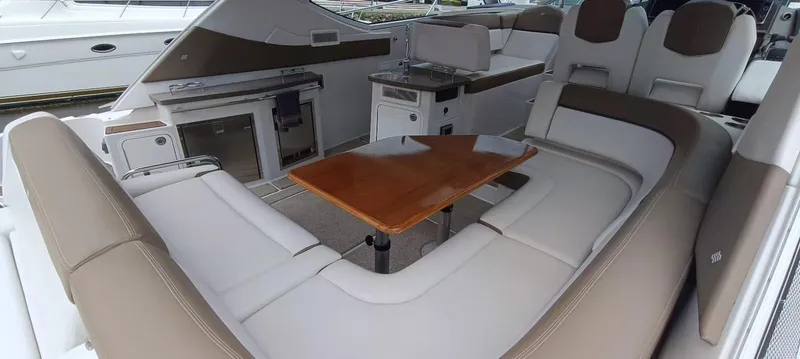 2016 Four Winns H440 Yacht Photos Pics Luxurious interior of 2016 Four Winns H440 boat with seating and table.