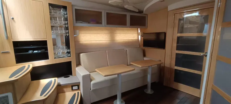 2016 Four Winns H440 Yacht Photos Pics Luxurious interior of 2016 Four Winns H440 yacht with modern seating and wooden accents.