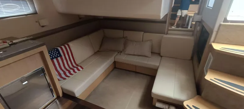 2016 Four Winns H440 Yacht Photos Pics Interior of 2016 Four Winns H440 yacht with cozy seating and American flag decor.