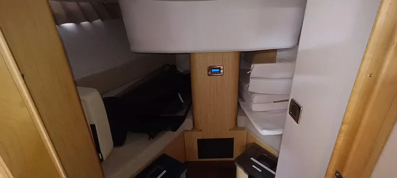 2016 Four Winns H440 Yacht Photos Pics 2016 Four Winns H440 cabin interior with seating and storage.