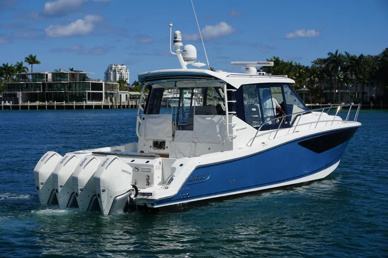 Rendezvous Yacht Photos Pics 2021 Boston Whaler 405 Conquest boat cruising on a sunny day.