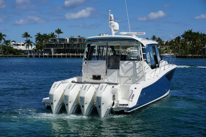 Rendezvous Yacht Photos Pics 2021 Boston Whaler 405 Conquest boat cruising on a sunny day with four engines.