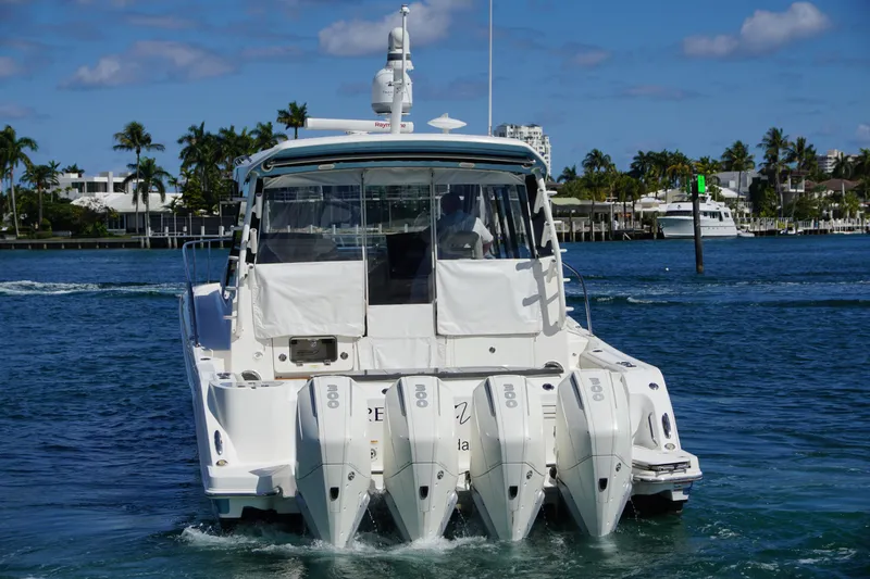 Rendezvous Yacht Photos Pics 2021 Boston Whaler 405 Conquest boat with four engines on a sunny day.