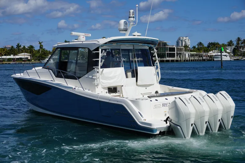 Rendezvous Yacht Photos Pics 2021 Boston Whaler 405 Conquest boat cruising on a sunny day.