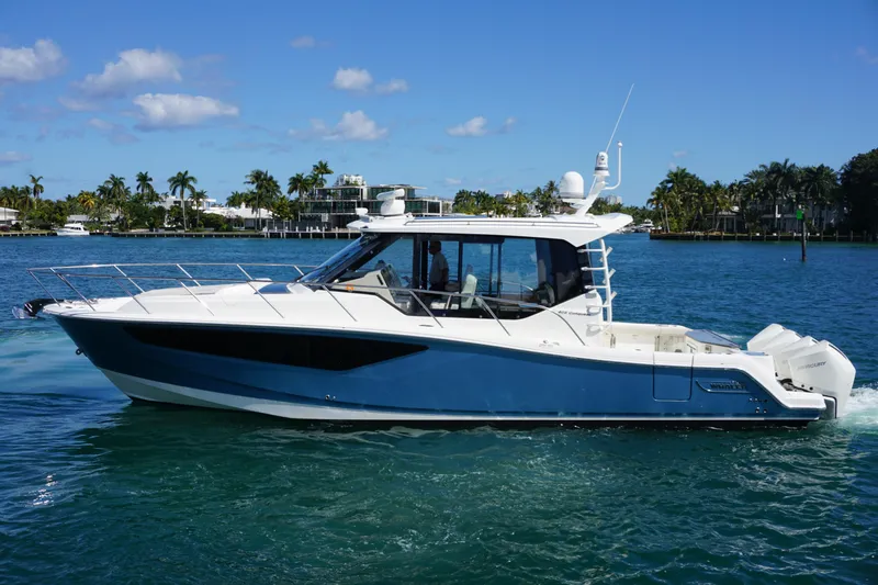 Rendezvous Yacht Photos Pics 2021 Boston Whaler 405 Conquest boat cruising on a sunny day.