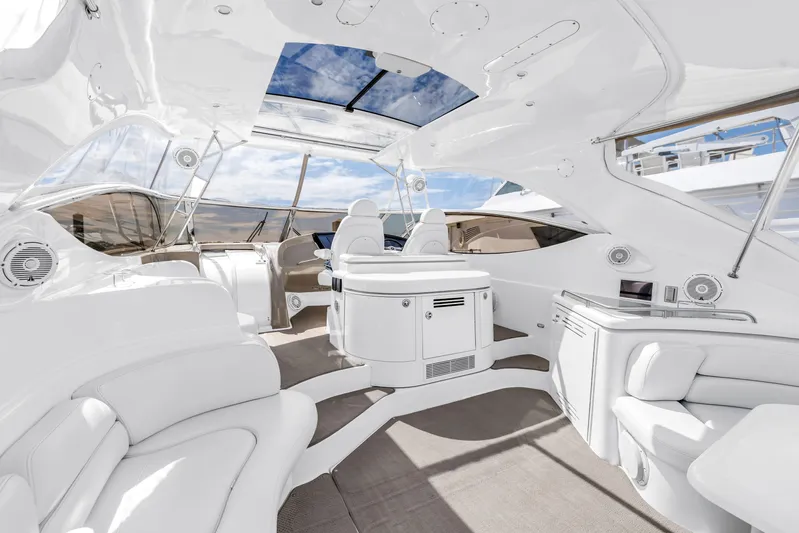  Yacht Photos Pics Luxurious 2002 Cruisers 5370 yacht interior with sleek white seating and modern amenities.