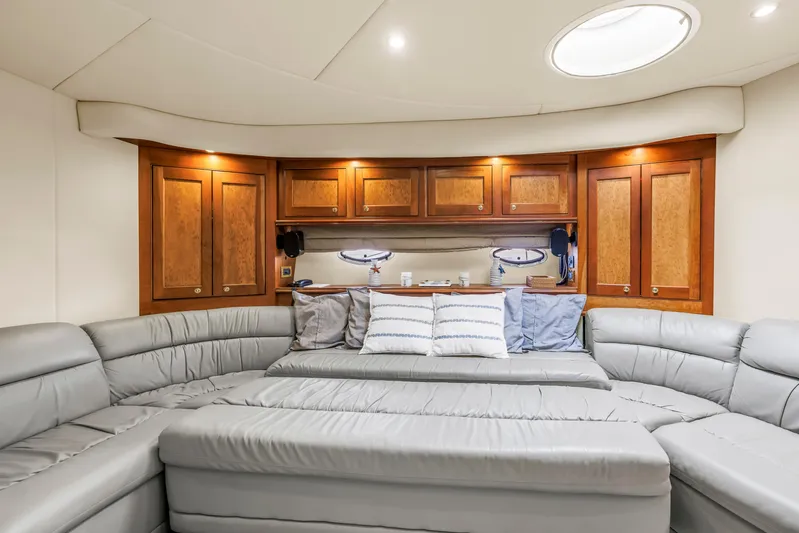  Yacht Photos Pics Luxurious 2002 Cruisers 5370 yacht interior with plush seating and elegant wood cabinetry.