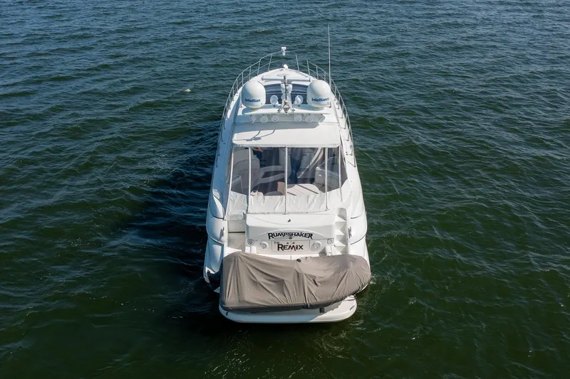  Yacht Photos Pics 2002 Cruisers 5370 yacht on open water, aerial rear view.