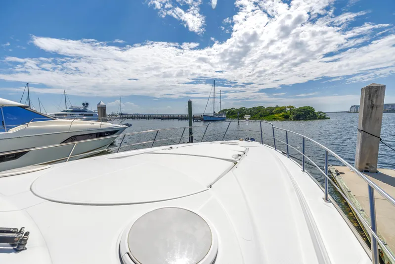  Yacht Photos Pics 2002 Cruisers 5370 yacht docked at marina with scenic ocean view.