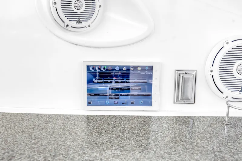  Yacht Photos Pics Control panel and speakers on a 2002 Cruisers 5370 yacht dashboard.